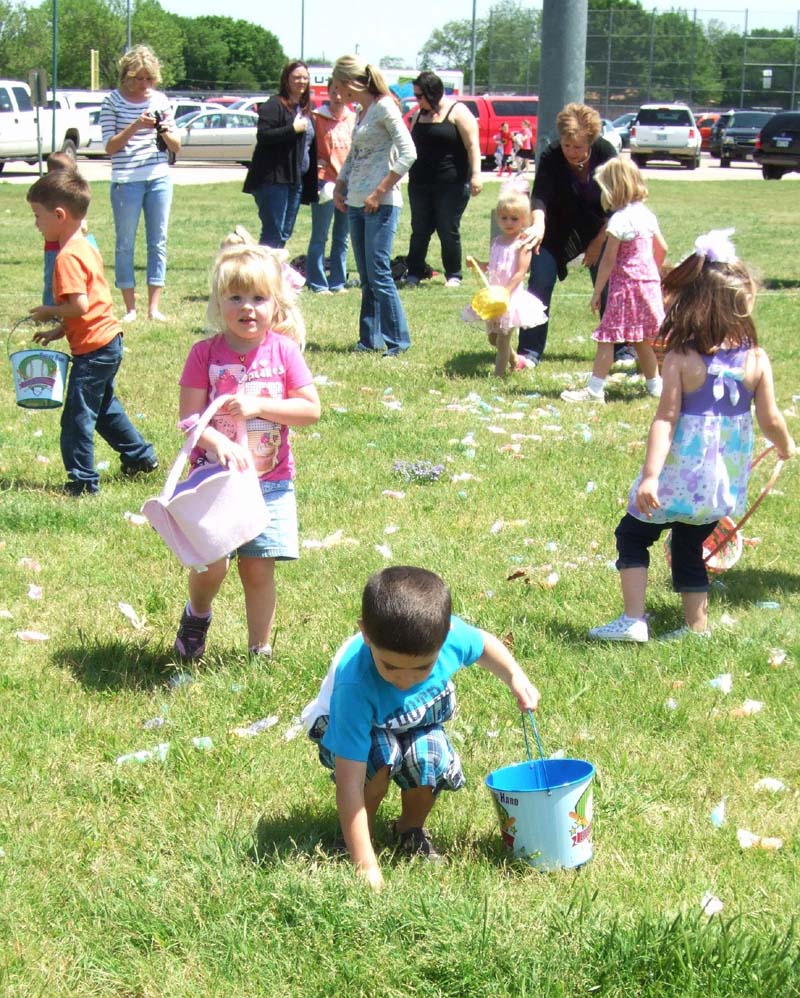 photo of kids and parents hunting for eggs